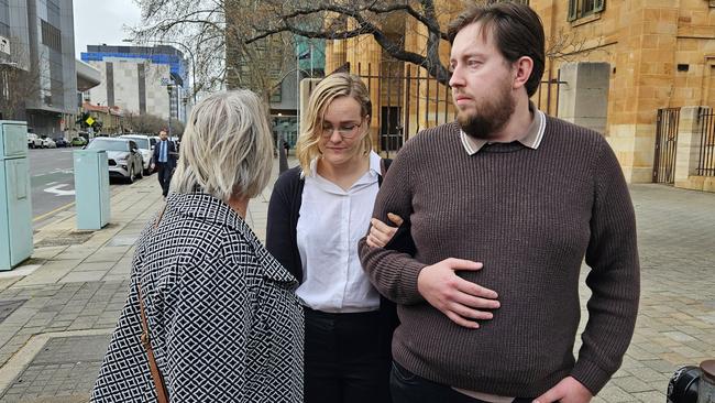 Elizabeth Meg Krainz, centre, outside the Adelaide Magistrates Court. Picture: Sean Fewster