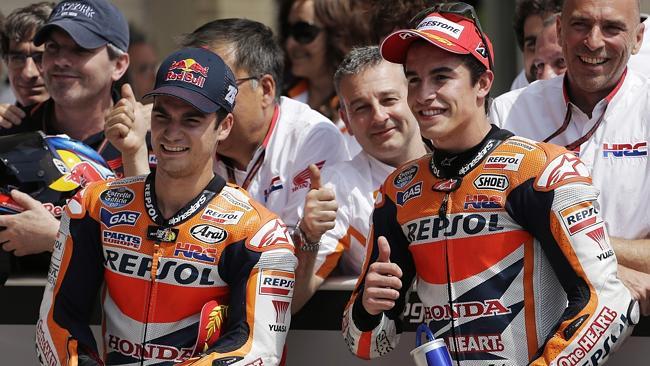 Dani Pedrosa (L) and Marc Marquez.