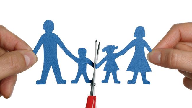 Thinkstock - Divorce: Paper chain family divorce held by hands and scissors cutting family apart.