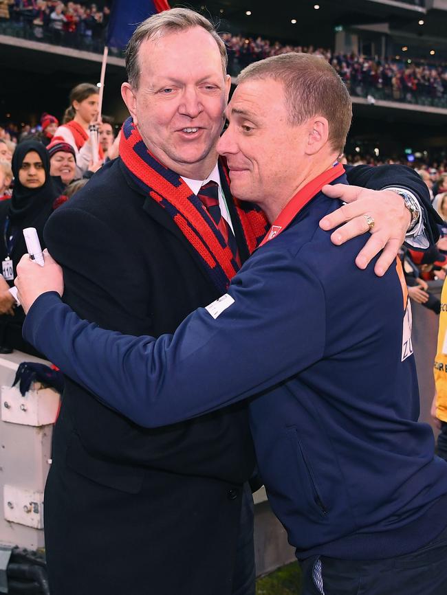 Melbourne president Glen Bartlett hugs coach Simon Goodwin after the game. Picture: Getty Images