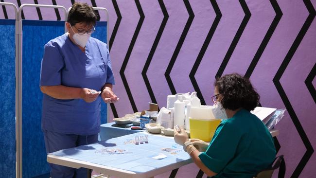 Medical workers prepare doses of the Moderna Covid-19 vaccine at the Museum of Contemporary Art near Turin, Italy earlier this week. Picture: AFP