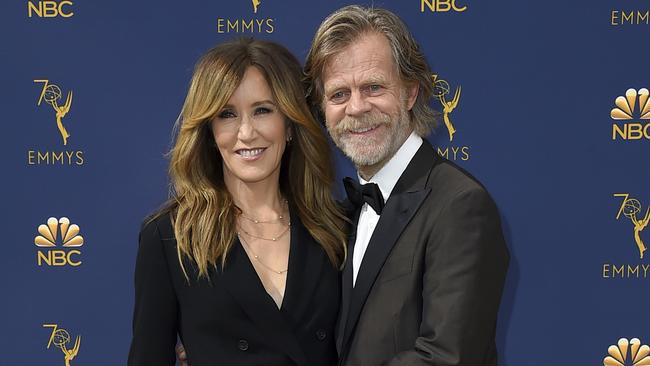 Felicity Huffman, left, and William H. Macy arrive at the 70th Prime time Emmy Awards in Los Angeles.