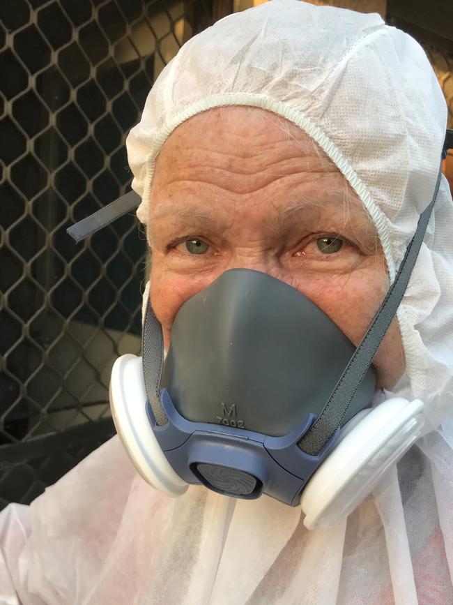 Ms Hudson wore a hazmat suit to enter her previous Campbelltown home that was contaminated by black mould. Picture: Supplied