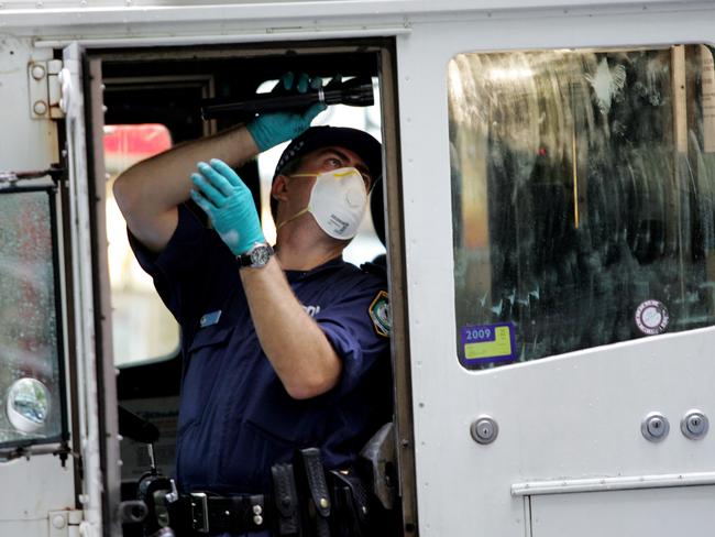 Police forensic officers gathering evidence at the 2009 North Sydney armoured van robbery.