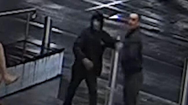 Detectives investigating the theft of an ATM at Cameron Park wish to speak with two men shown here. Picture: NSW Police