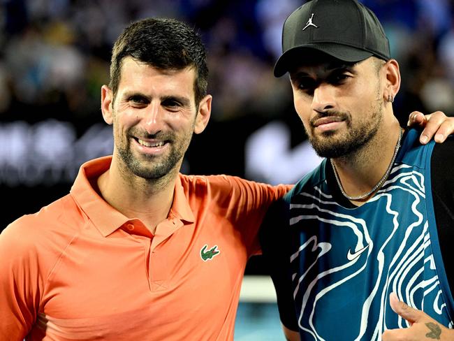 Serbia's Novak Djokovic (L) and Australia's Nick Kyrgios pose for pictures during their Arena Showdown charity match ahead of the Australian Open tennis tournament in Melbourne on January 13, 2023. (Photo by WILLIAM WEST / AFP) / --IMAGE RESTRICTED TO EDITORIAL USE - STRICTLY NO COMMERCIAL USE--