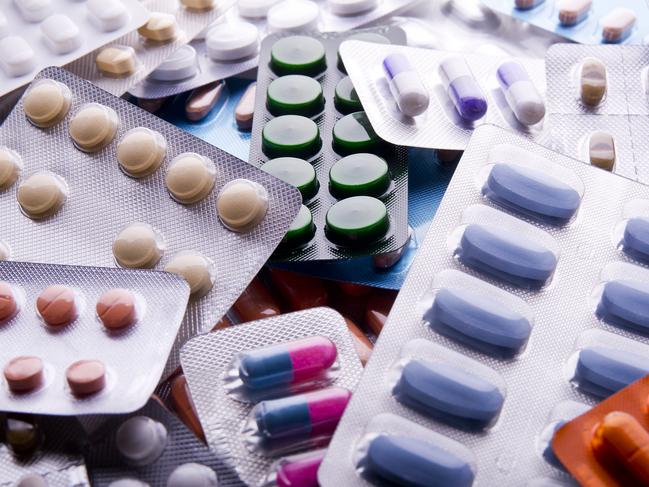 Close up of packs of pills and capsules.