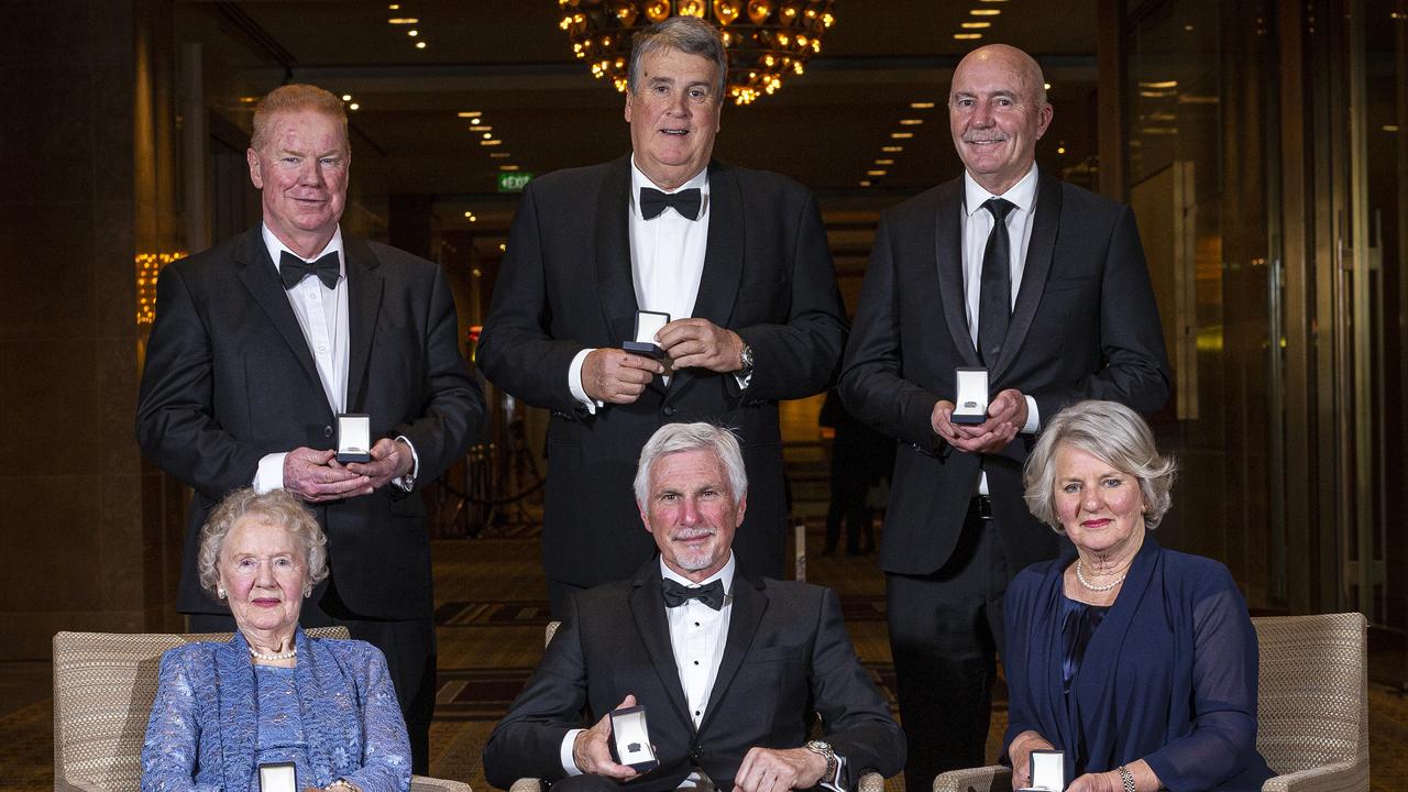 2019 Inductees and representatives (L-R top) Brad Hardie, Michael Deane (son of Jim Deane), Ken Hunter, and (L-R bottom) Norma Barker (mother of Trevor Barker), Mick Malthouse, Andrea Evans (wife of Ron Evans) pose for a photo during the 2019 Australian Football Hall Of Fame Induction Dinner at Crown Palladium in Melbourne, Tuesday, June 4, 2019. (AAP Image/Daniel Pockett) NO ARCHIVING