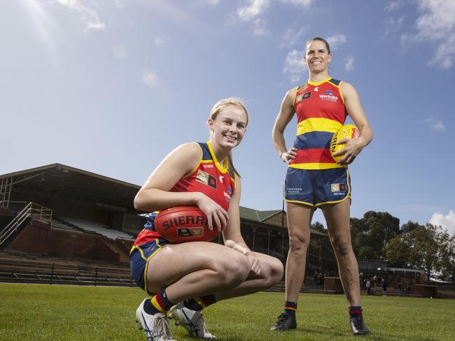 Adelaide Crows player Brooke Tonon with her captain Chelsea Randall at the Crows new headquarters at Thebarton Oval, 24 August 2022. Picture: Simon Cross