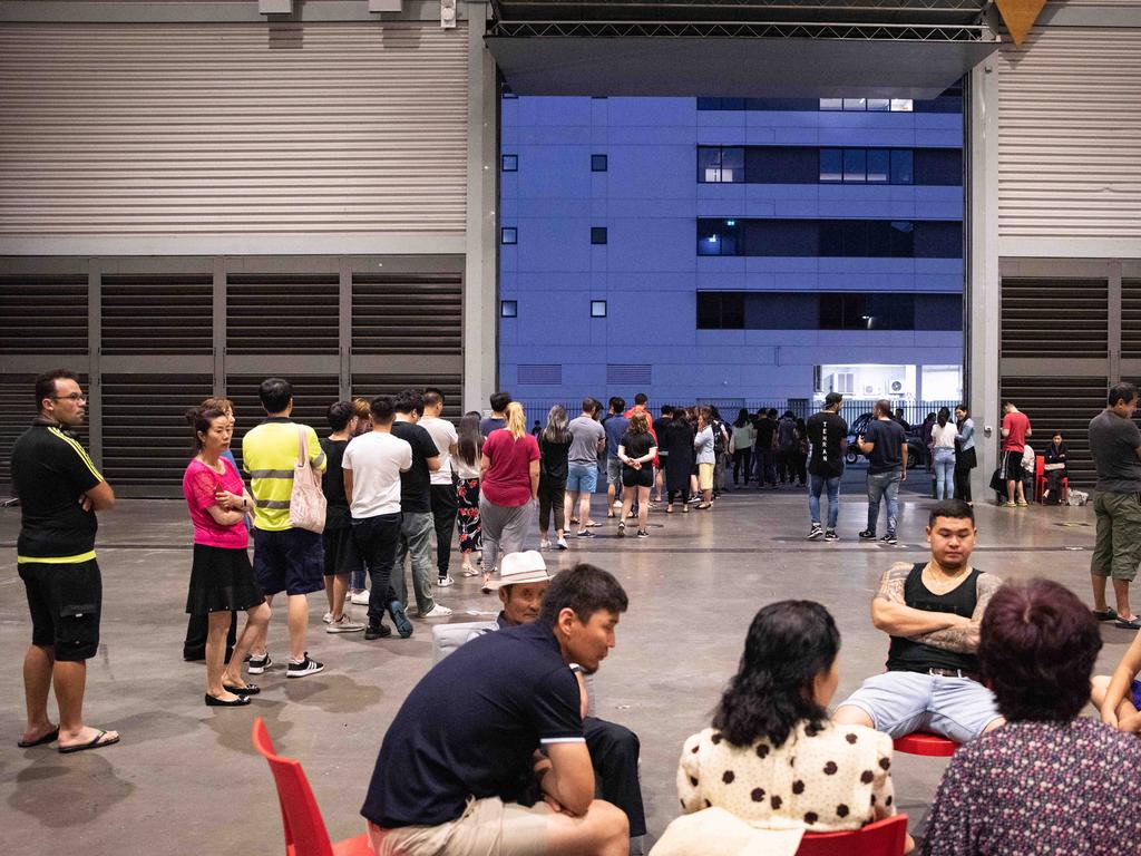 Evacuees photographed inside of the exhibition hall where they are staying. Picture: Flavio Brancaleone