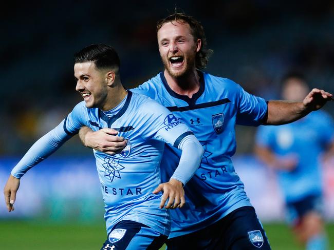 Marco Tilio of Sydney celebrates scoring a goal with team mate Rhyan Grant of Sydney during the Round 20 A-League match between the Central Coast Mariners and the Sydney FC at Central Coast Stadium in Gosford, Sunday, February 23, 2019. (AAP Image/Brendon Thorne) NO ARCHIVING, EDITORIAL USE ONLY