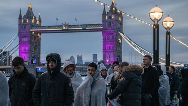 Members of the public walk in line along The Queens Walk near Tower Bridge waiting to pay their respects to Queen Elizabeth II in London. Picture: Getty Images