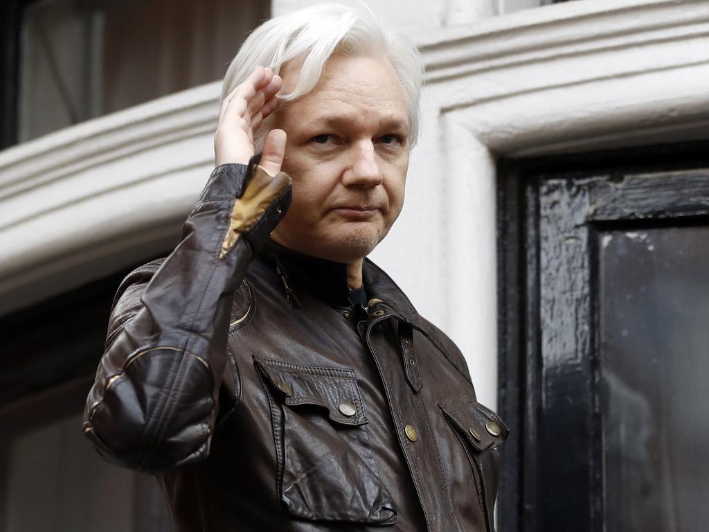 WikiLeaks founder Julian Assange greets supporters from a balcony of the Ecuadorian embassy in London on May 19, 2017. Picture: AP