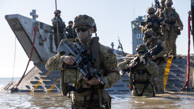 Personnel from 3rd Battalion Royal Australian Regiment, conduct a beach assault on Forrest Beach, Queensland, during Exercise Talisman Sabre 2021.