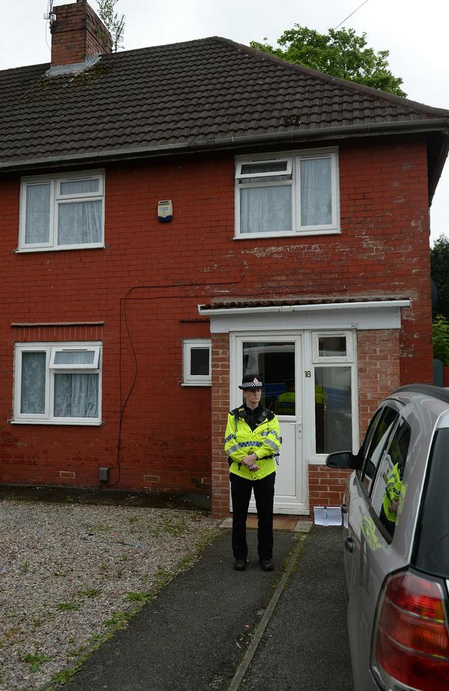 A police officer stands on duty outside a residential property on Aston Avenue in Fallowfield, Manchester, the home of Salman Abedi. Picture: AFP