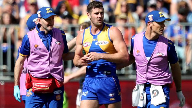 Jack Darling is helped from the field after injuring his ankle.