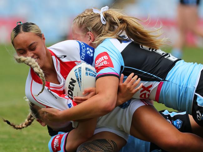 Courageous Afoa of the Dragons is tacked by Taylor Charman of the Sharks during the Round 1 Tarsha Gale Cup match between Cronulla Sharks and St George Illawarra Dragons at PointsBet Stadium in Sydney on February 5, 2022 (Photo by Jeremy Ng / Newscorp