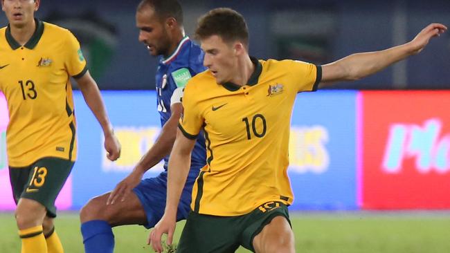 Australia's midfielder Ajdin Hrustic (R) vies for the ball with Kuwait's midfielder Bader al-Motawaa during the 2022 FIFA World Cup qualification group B football match between Australia and Kuwait at the Jaber Al-Ahmad Stadium in Kuwait City on June 3, 2021. (Photo by Yasser Al-Zayyat / AFP)