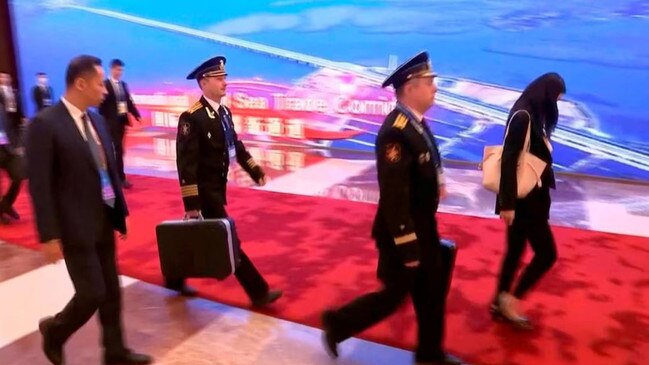 Footage has emerged showing Russian President Vladimir Putin  accompanied by officers with a nuclear briefcase during his trip to China.