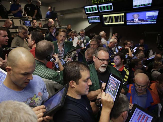 CHICAGO, IL - DECEMBER 16 : Traders in the Standard & Poor's 500 stock index options pit at the Chicago Board Options Exchange (CBOE) react to the Federal Reserves interest rate hike December 16, 2015 in Chicago, Illinois. The Federal Reserves raised the interest rates for the first time since 2006 by 0.25 percentage points. Joshua Lott/Getty Images/AFP == FOR NEWSPAPERS, INTERNET, TELCOS & TELEVISION USE ONLY ==