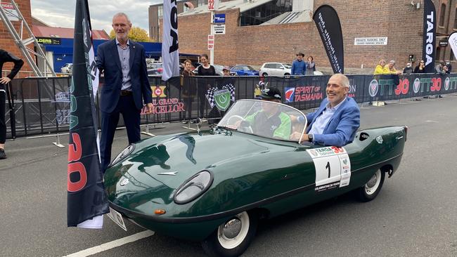 Rod Belbin driving the Targa Tasmania flag car with Nick Duigan. Launceston Mayor Albert Van Zetten sends the 1959 Go Go Mobile on its way. It is first over the line each day. Picture: James Bresnehan