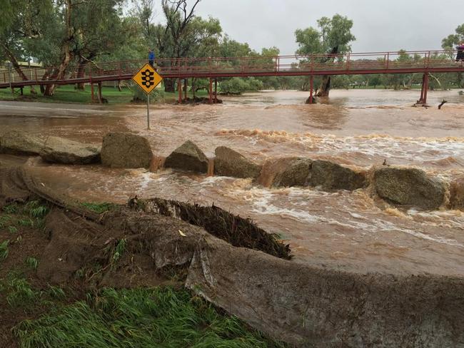 Flood waters creep up the Undoolya Rd Todd River crossing. PHOTO: Amber Chambers