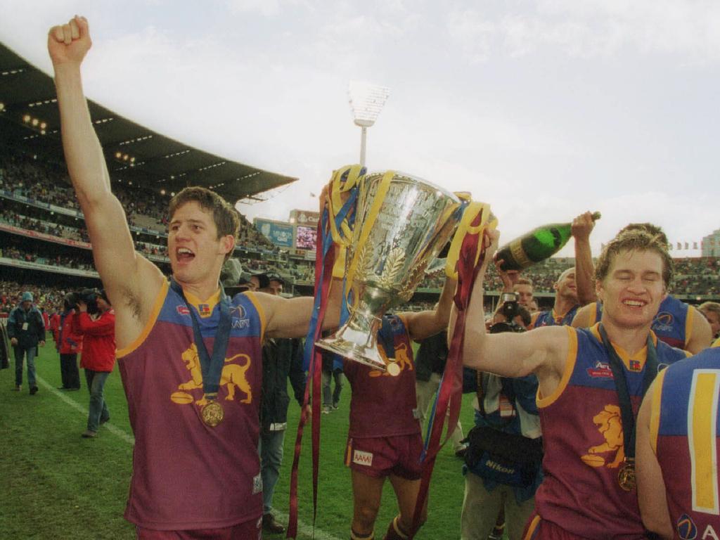 28/09/2002. Aaron Shattock and Luke Power with premiership cup. 2002 Grand Final. Brisbane Lions v Collingwood. MCG.