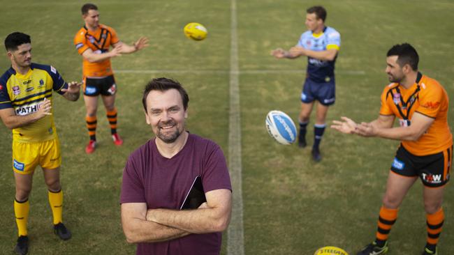 Fusion Sport founder and app developer Markus Deutsch with some rugby league players at Langlands Park Rugby League Oval in Brisbane. Picture: Glenn Hunt