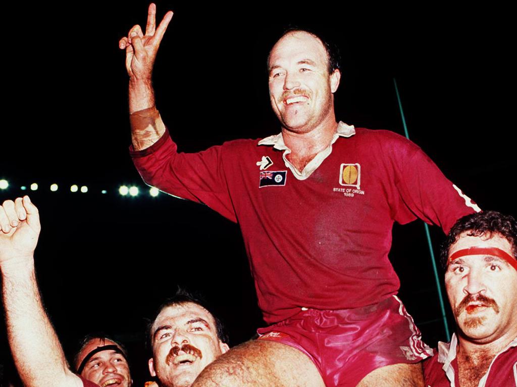 Wally Lewis is carried from the field of Lang Park by Sam Backo (R) and Martin Bella after a win during the 1991 State of Origin series.