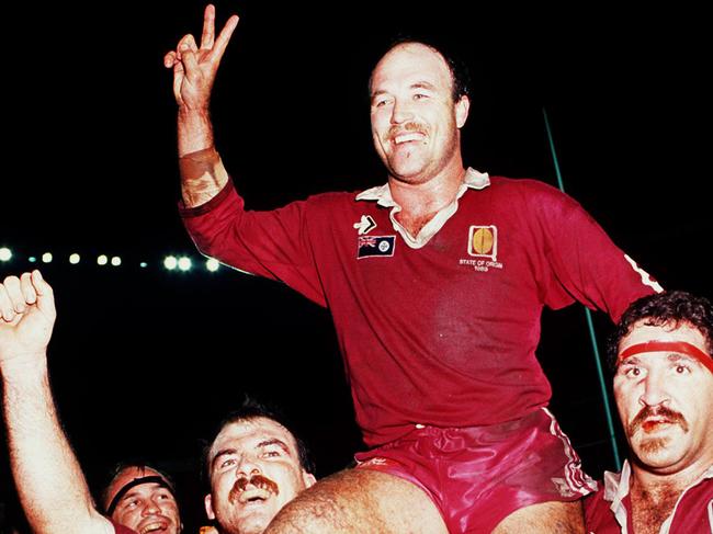 Wally Lewis is carried from the field of Lang Park by Sam Backo (R) and Martin Bella after a win during the 1991 State of Origin series.