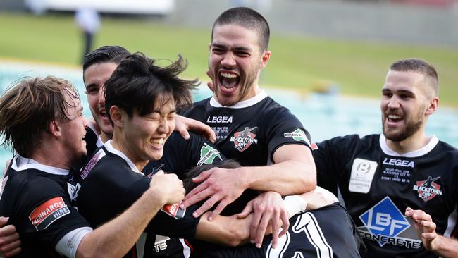 Blacktown FC players celebrate a Danny Choi goal.