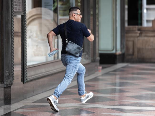 Nedal Haouchar sprints out of court and away from the media on Wednesday. Picture: Julian Andrews