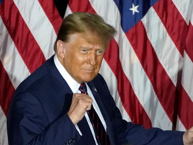 Republican presidential hopeful and former US President Donald Trump gestures during an Election Night Party in Nashua, New Hampshire, on January 23, 2024. Donald Trump won the key New Hampshire primary Tuesday, moving him ever closer to locking in the Republican presidential nomination and securing an extraordinary White House rematch with Joe Biden. (Photo by TIMOTHY A. CLARY / AFP)