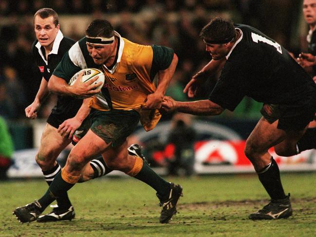 Wallabies Phil Kearns is grabbed by All Blacks Craig Dowd during Australia v New Zealand Bledisloe Cup game at MCG in 1998.