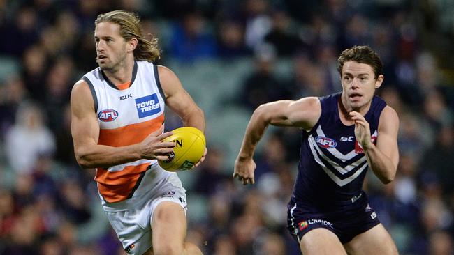 Callan Ward gives Lachie Neale the slip. Picture: Daniel Wilkins
