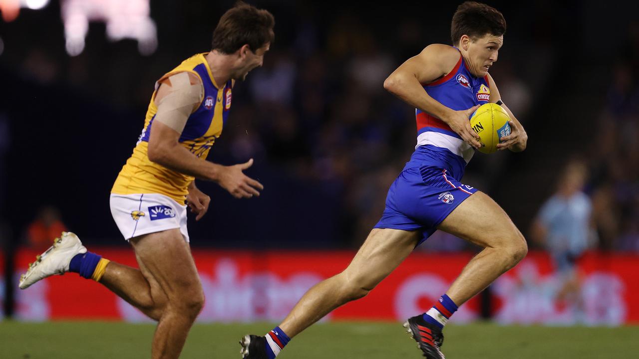 Bulldog Laitham Vandermeer charges past Andrew Gaff on the way to kicking a crucial final-quarter goal. Picture: Michael Klein