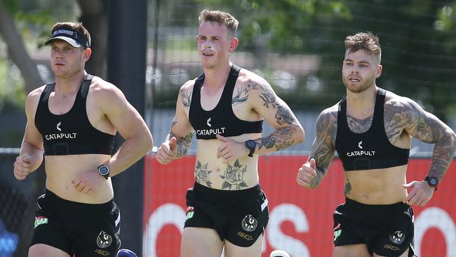 Taylor Adams, Ben Crocker and Jamie Elliott putting in the hard yards during the pre-season.