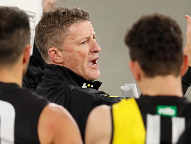 MELBOURNE, AUSTRALIA - JUNE 11: Damien Hardwick, Senior Coach of the Tigers addresses his players during the 2020 AFL Round 02 match between the Collingwood Magpies and the Richmond Tigers at the Melbourne Cricket Ground on June 11, 2020 in Melbourne, Australia. (Photo by Michael Willson/AFL Photos via Getty Images)