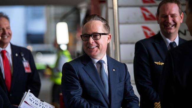 Qantas CEO Alan Joyce (C) gave his staff a bonus helping to ease some of the tension on wages. Picture: Wendell Teodoro / AFP