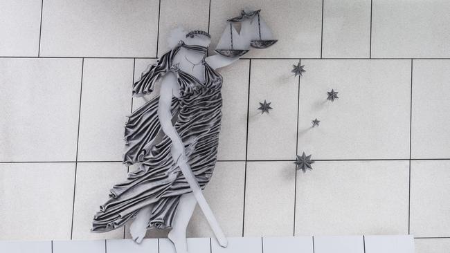 County Court file pictures, Building front 250 Williams Street, emblem, southern cross, lady and sword.