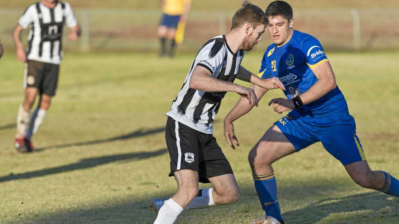 CLOSE BATTLE: Willowburn's Brayden Thrupp (left) competes with USQ's Alex Dyball. Willowburn plays Rockville tomorrow for a spot in the Toowoomba Football League premier men's grand final. Picture: Kevin Farmer