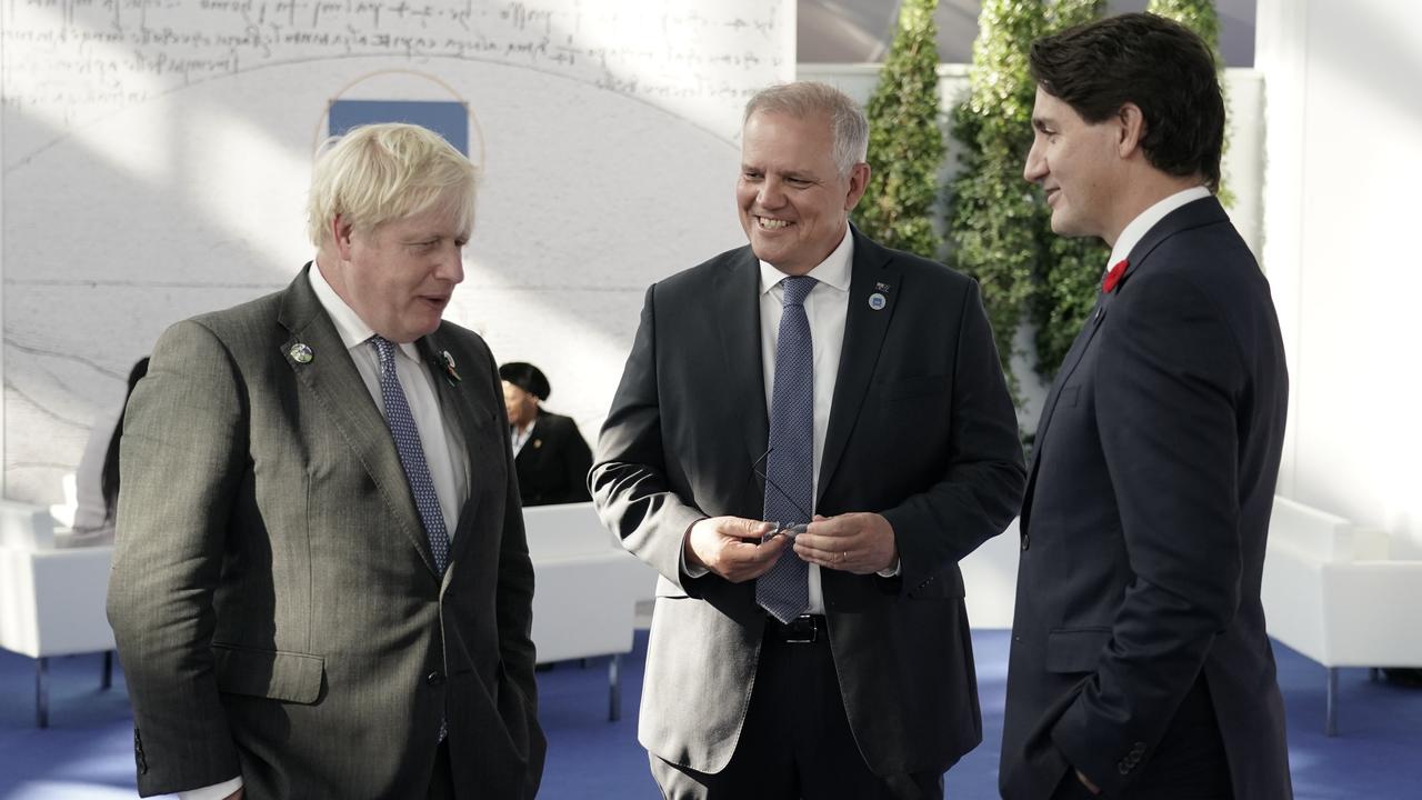 Prime Minister Scott Morrison attends the G20 Official Welcome and Family photo and chats with Boris Johnson and Justin Trudeau in Rome. Picture: Adam Taylor