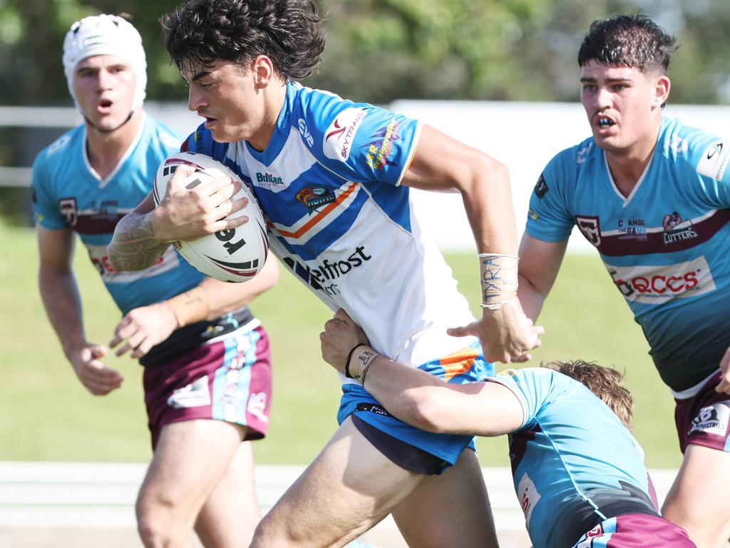 Kees Anderson busts through a tackle in the Queensland Rugby League (QRL) Under 19 Men's match between the Northern Pride and the Mackay Cutters, held at Barlow Park. Picture: Brendan Radke