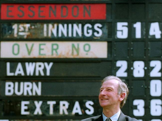 Bill Lawry in front of the scoreboard at the ground named after him in 2001.