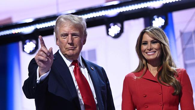 US former President and 2024 Republican presidential candidate Donald Trump stands next to Former US First Lady Melania Trump onstage during the last day of the 2024 Republican National Convention at the Fiserv Forum in Milwaukee, Wisconsin, on July 18, 2024. Donald Trump will get a hero's welcome Thursday as he accepts the Republican Party's nomination to run for US president in a speech capping a convention dominated by the recent attempt on his life. (Photo by Brendan SMIALOWSKI / AFP)