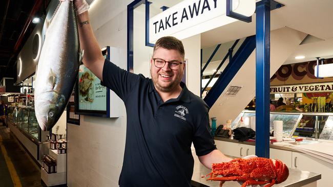 Alex Knoll with popular seafood over Easter at Angelakis Bros in the Adelaide Central Market. Picture: Matt Loxton