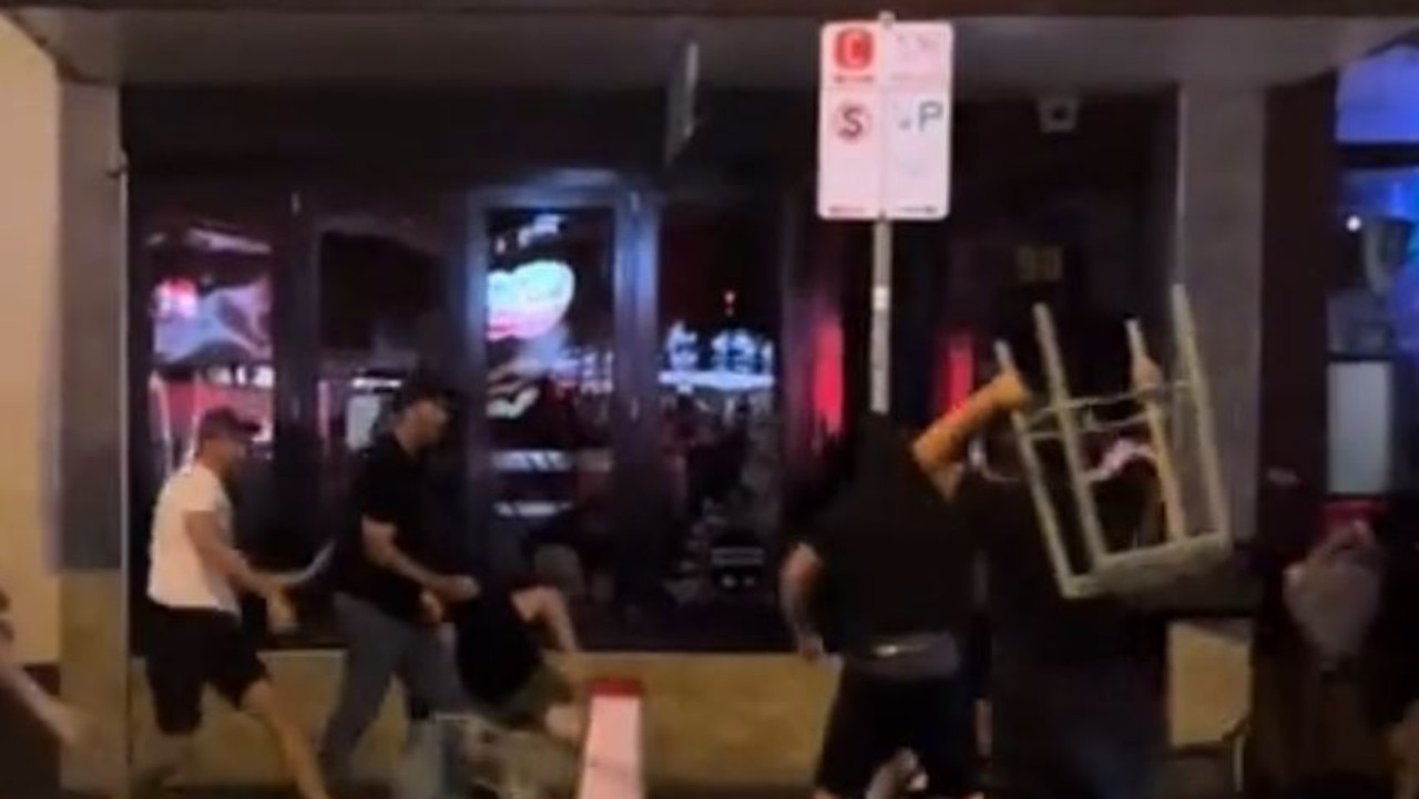 Rival Melbourne soccer fans hurl bar stools in violent Richmond brawl