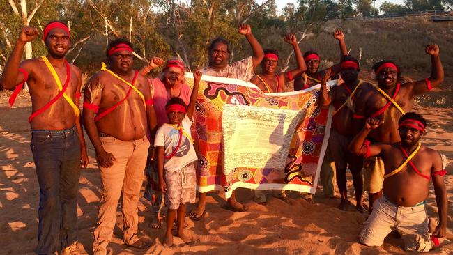 A group of Aboriginals with the Uluru Statement.