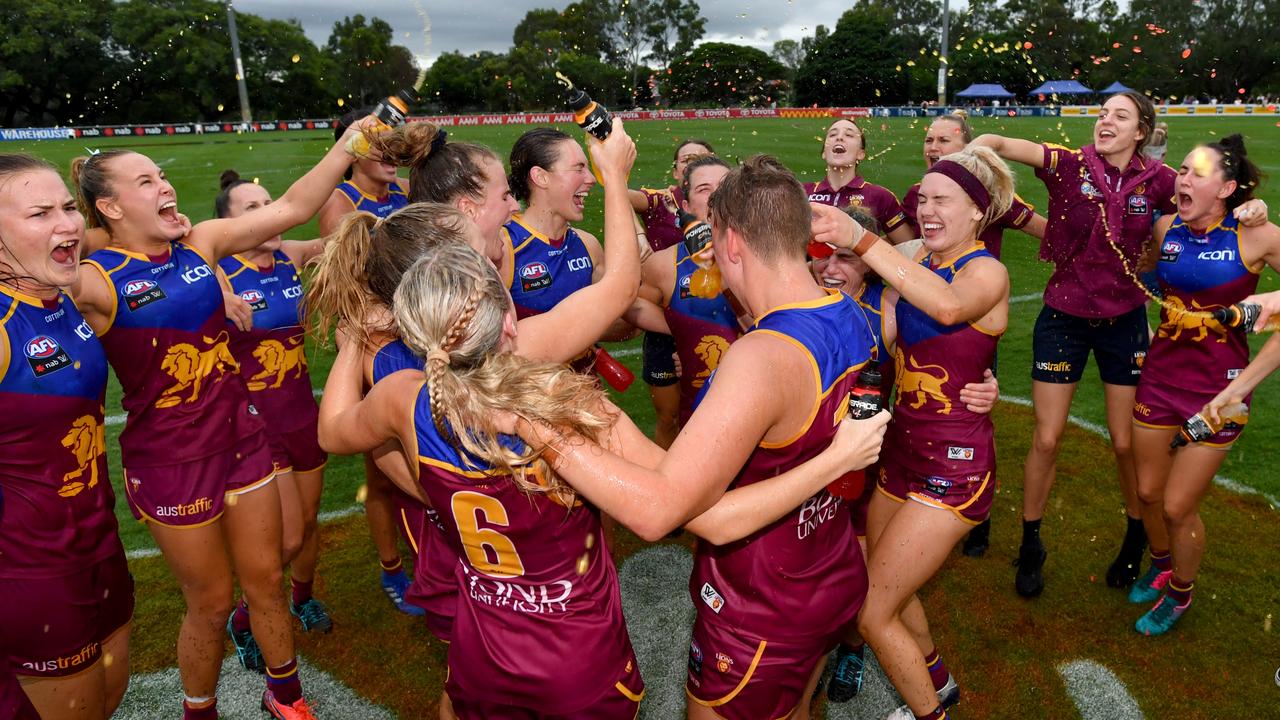 Brisbane Lions players enjoy the spoils of their victory over Adelaide.