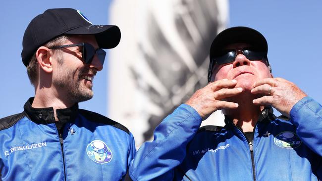 Star Trek actor William Shatner (R) gestures as Planet Labs co-founder Chris Boshuizen after they flew into space.